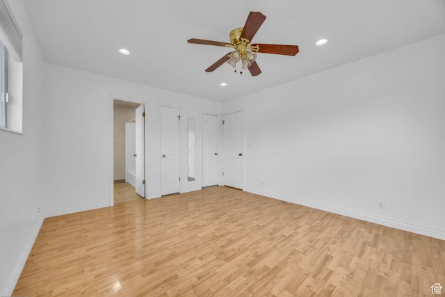5350 S 3450 W, Roy, UT 84067 - unfurnished bedroom featuring light wood-type flooring, multiple closets, recessed lighting, and a ceiling fan