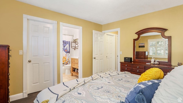 1138 Briggs Dr, Bountiful, UT 84010 - carpeted bedroom featuring ensuite bath and baseboards