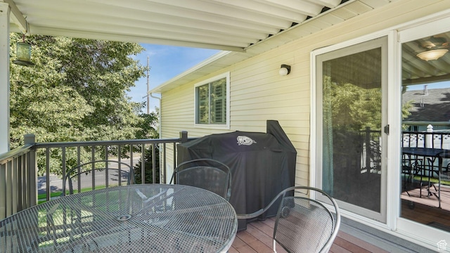 1138 Briggs Dr, Bountiful, UT 84010 - wooden deck with outdoor dining space and area for grilling