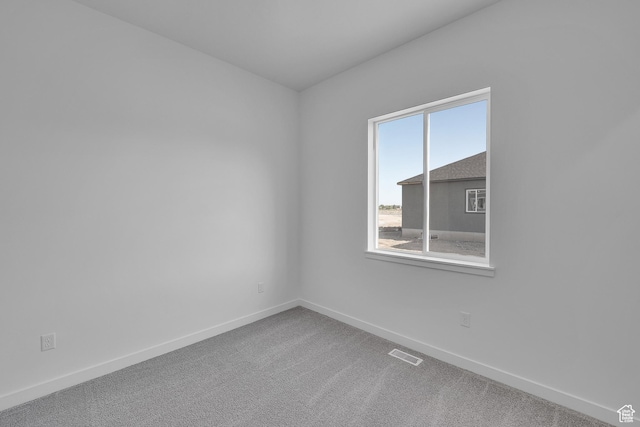 1086 S 3170 E Unit 217, Spanish Fork, UT 84660 - spare room featuring baseboards and carpet flooring
