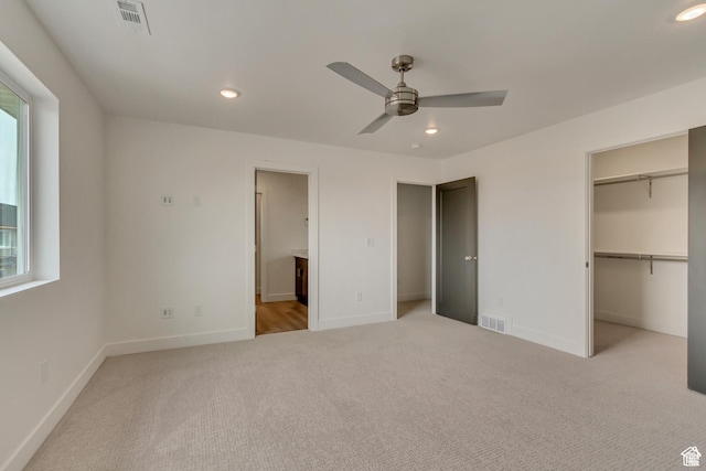 1352 N 1440 E Unit 21, Payson, UT 84651 - unfurnished bedroom with light colored carpet, a spacious closet, recessed lighting, ensuite bathroom, and a ceiling fan