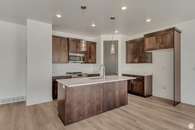 1352 N 1440 E Unit 21, Payson, UT 84651 - kitchen featuring appliances with stainless steel finishes, light wood-style floors, light countertops, dark brown cabinets, and recessed lighting