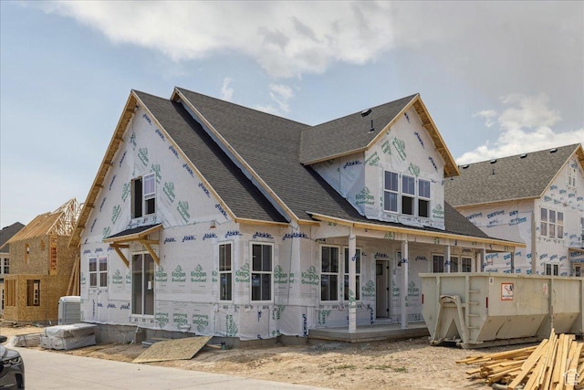 6782 W Docksider Dr Unit 302, South Jordan, UT 84009 - view of front facade with covered porch, roof with shingles, and stucco siding
