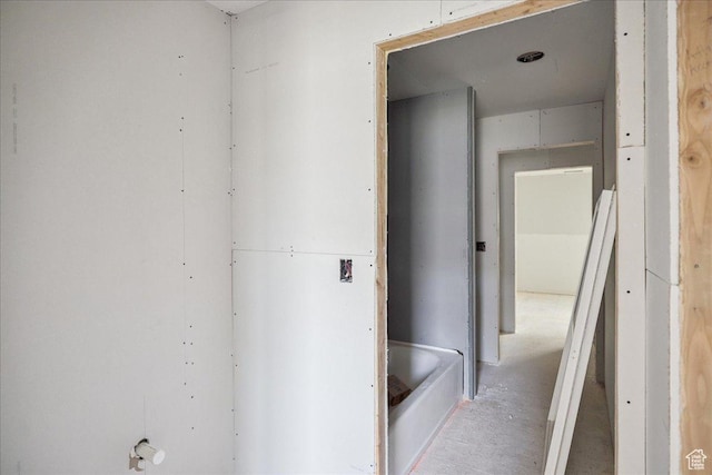 6782 W Docksider Dr Unit 302, South Jordan, UT 84009 - bathroom featuring a tub to relax in and concrete flooring