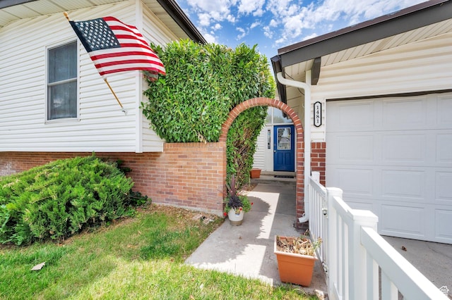 1481 W Bluemont Dr, Murray, UT 84123 - entrance to property featuring a garage and brick siding