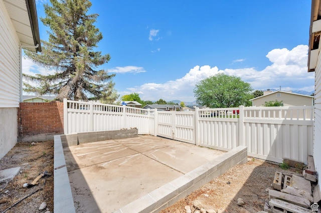 1481 W Bluemont Dr, Murray, UT 84123 - fenced backyard featuring a patio