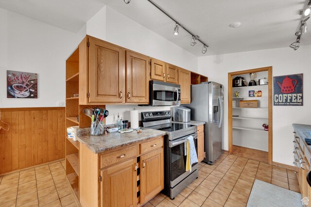 1481 W Bluemont Dr, Murray, UT 84123 - kitchen featuring appliances with stainless steel finishes, open shelves, rail lighting, wood walls, and light stone counters