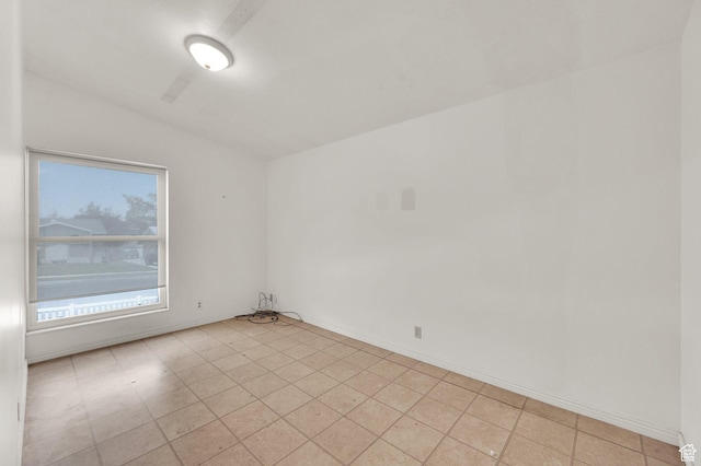 1481 W Bluemont Dr, Murray, UT 84123 - empty room featuring vaulted ceiling and light tile patterned floors