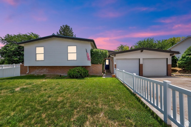 1481 W Bluemont Dr, Murray, UT 84123 - view of front facade featuring a garage, an outbuilding, driveway, and brick siding