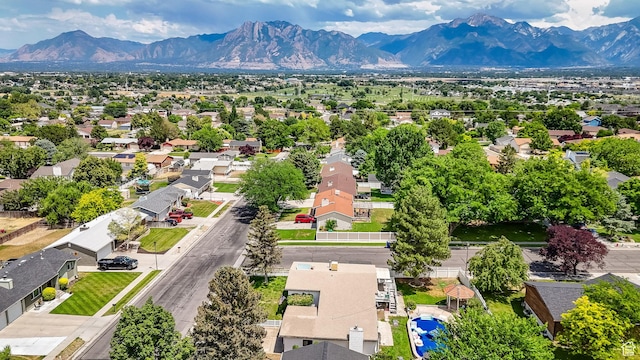 1481 W Bluemont Dr, Murray, UT 84123 - aerial perspective of suburban area with a mountainous background