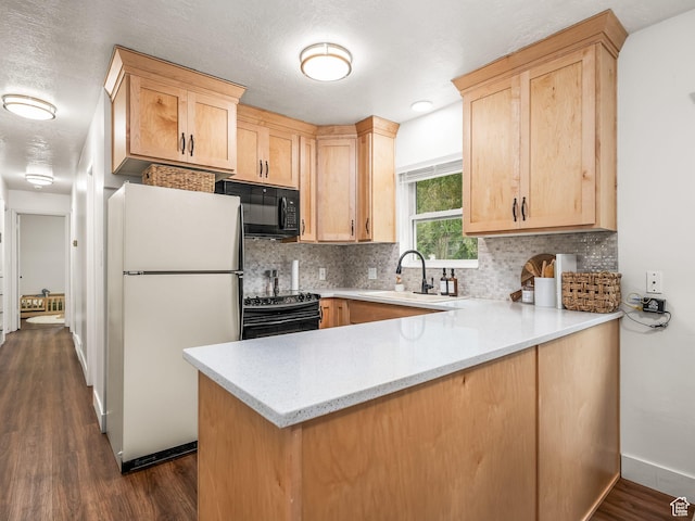 155 S 300 W, Spanish Fork, UT 84660 - kitchen with black appliances, a peninsula, light brown cabinetry, and backsplash