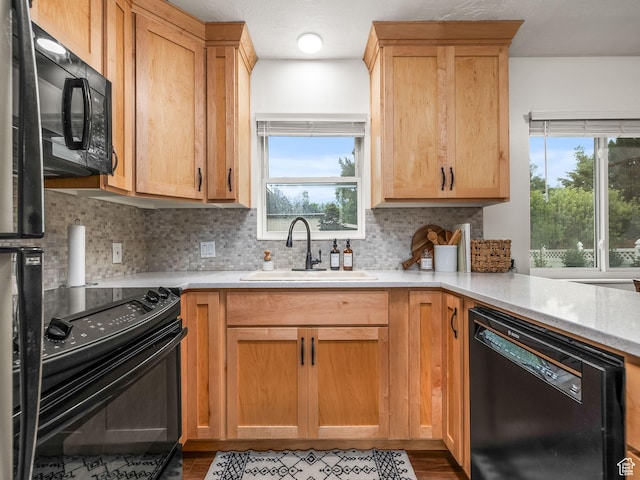 155 S 300 W, Spanish Fork, UT 84660 - kitchen with black appliances, backsplash, plenty of natural light, and wood finished floors