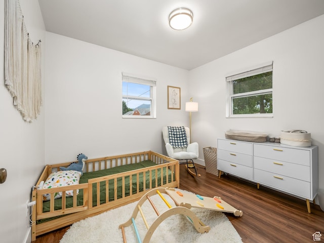 155 S 300 W, Spanish Fork, UT 84660 - bedroom featuring dark wood-style flooring and a nursery area