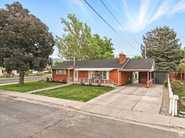 155 S 300 W, Spanish Fork, UT 84660 - single story home with a porch, driveway, brick siding, an attached carport, and a chimney