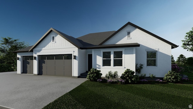 444 E 1600 S Unit 1, Orem, UT 84058 - modern inspired farmhouse with an attached garage, driveway, a front lawn, and board and batten siding