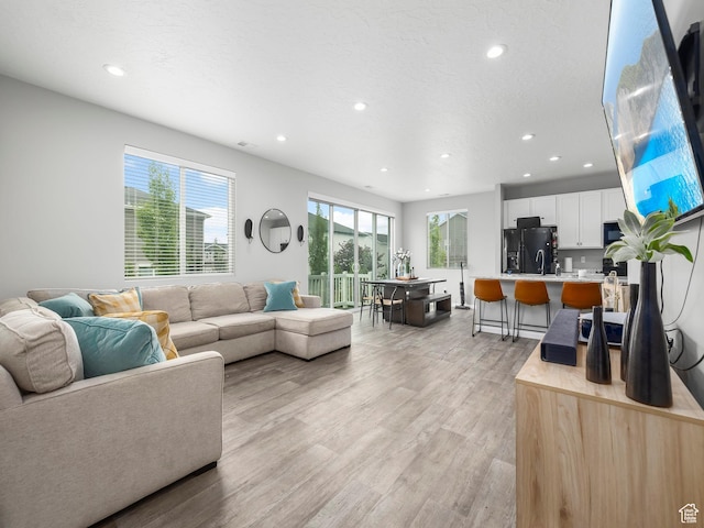 1493 N Sunset Dr, Spanish Fork, UT 84660 - living area with recessed lighting and light wood finished floors
