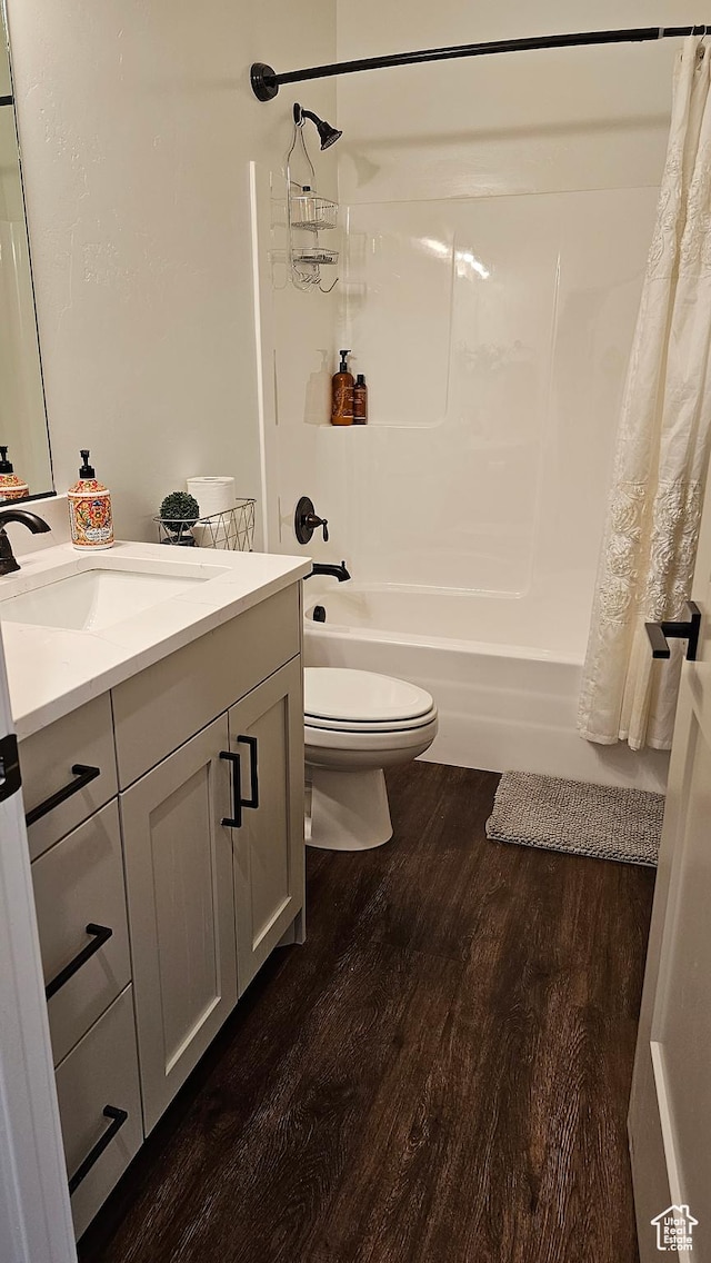 1268 E 300 S, Smithfield, UT 84335 - bathroom featuring vanity, shower / bath combination with curtain, and wood finished floors