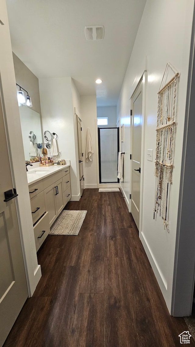 1268 E 300 S, Smithfield, UT 84335 - bathroom featuring wood finished floors, vanity, and a stall shower