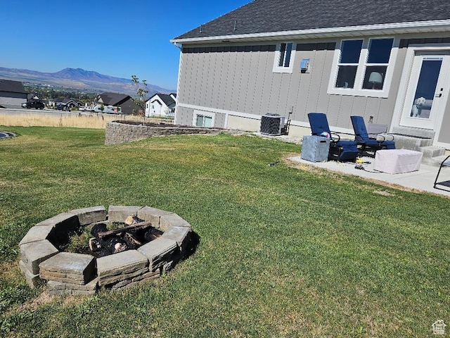1268 E 300 S, Smithfield, UT 84335 - view of grassy yard featuring a fire pit, a mountain view, and a patio