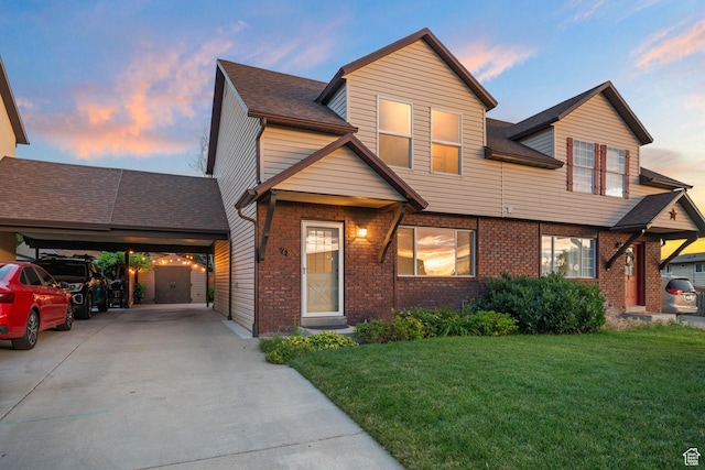 78 E 1450 S, Orem, UT 84058 - view of front facade featuring a front yard, driveway, brick siding, and a shed