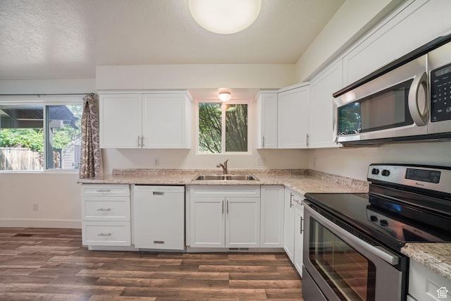 78 E 1450 S, Orem, UT 84058 - kitchen featuring appliances with stainless steel finishes, dark wood-type flooring, white cabinetry, and light stone countertops