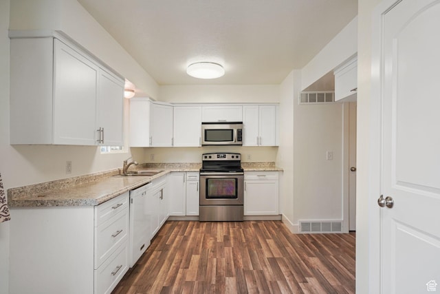 78 E 1450 S, Orem, UT 84058 - kitchen with appliances with stainless steel finishes, dark wood-type flooring, and white cabinetry