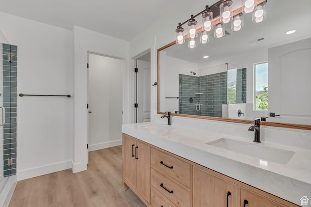 13749 S Crimson Patch Way, Riverton, UT 84096 - full bath with a tile shower, wood finished floors, double vanity, and recessed lighting