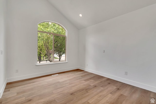 13749 S Crimson Patch Way, Riverton, UT 84096 - spare room featuring light wood-style floors, vaulted ceiling, and recessed lighting