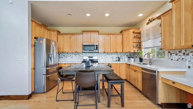 13994 S Stone Dr E, Draper, UT 84020 - kitchen featuring stainless steel appliances, light wood-type flooring, recessed lighting, light countertops, and decorative backsplash