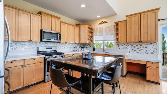 13994 S Stone Dr E, Draper, UT 84020 - kitchen with stainless steel appliances, open shelves, light wood-style flooring, light countertops, and recessed lighting