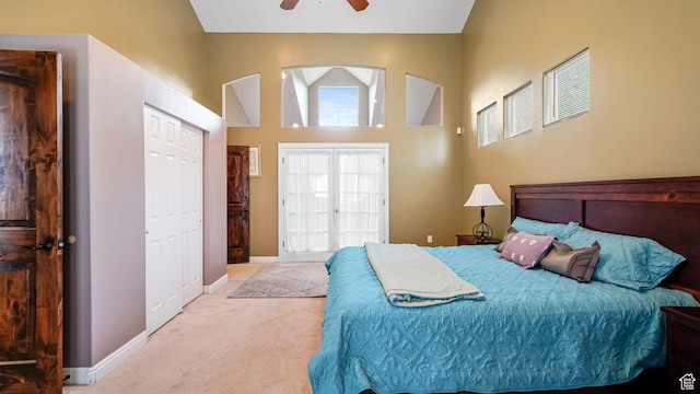 13994 S Stone Dr E, Draper, UT 84020 - bedroom with light carpet, a high ceiling, and a ceiling fan