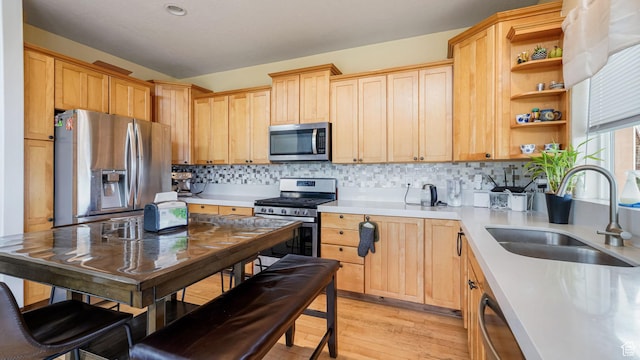 13994 S Stone Dr E, Draper, UT 84020 - kitchen with appliances with stainless steel finishes, light countertops, light wood-style floors, and open shelves