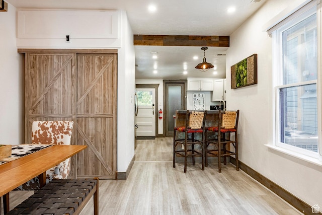 416 Marsac Ave, Park City, UT 84060 - dining area featuring light wood finished floors and beam ceiling