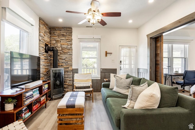 416 Marsac Ave, Park City, UT 84060 - living area with a wood stove, ceiling fan, plenty of natural light, light wood finished floors, and recessed lighting