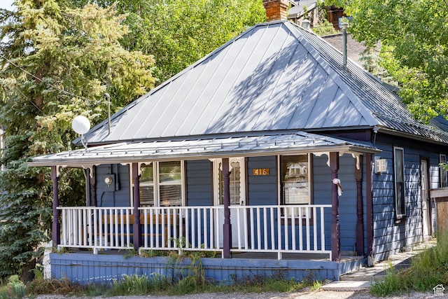 416 Marsac Ave, Park City, UT 84060 - view of front of home featuring a porch, a chimney, and a metal roof