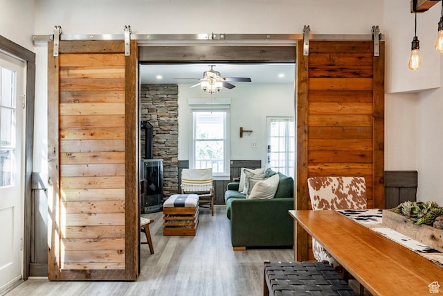 416 Marsac Ave, Park City, UT 84060 - living area with a barn door, light wood finished floors, and ceiling fan