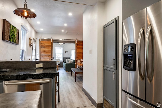 416 Marsac Ave, Park City, UT 84060 - kitchen featuring appliances with stainless steel finishes, light wood finished floors, dark countertops, recessed lighting, and open floor plan