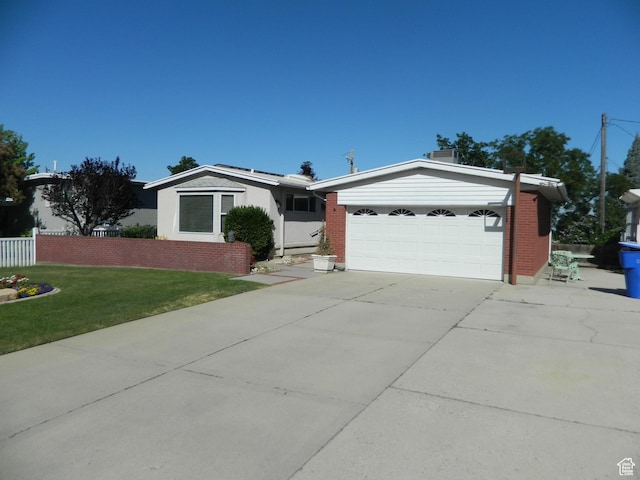 4222 S Edward Dr, Holladay, UT 84124 - ranch-style home with concrete driveway and a garage