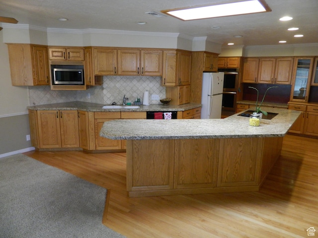 4222 S Edward Dr, Holladay, UT 84124 - kitchen with appliances with stainless steel finishes, brown cabinets, backsplash, crown molding, and recessed lighting