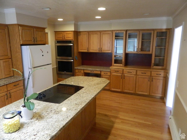 4222 S Edward Dr, Holladay, UT 84124 - kitchen with stainless steel double oven, freestanding refrigerator, brown cabinets, black electric stovetop, and ornamental molding