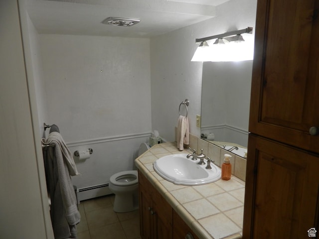 4222 S Edward Dr, Holladay, UT 84124 - bathroom featuring baseboard heating, vanity, and tile patterned flooring
