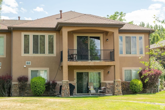 1959 W Golden Pond Way S, Orem, UT 84059 - back of house with a balcony, stucco siding, a yard, and stone siding