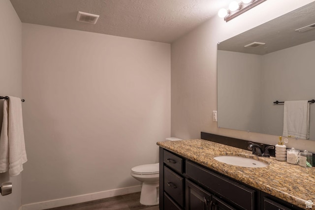 1959 W Golden Pond Way S, Orem, UT 84059 - bathroom with wood finished floors, vanity, and a textured ceiling