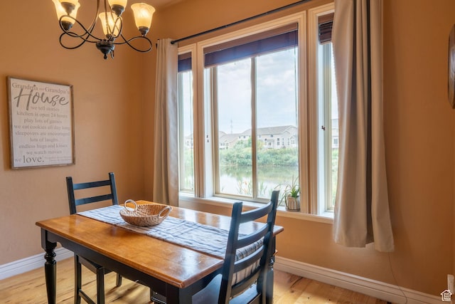 1959 W Golden Pond Way S, Orem, UT 84059 - dining area with healthy amount of natural light, a chandelier, and light wood-style flooring