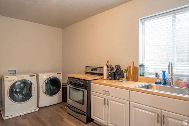 1959 W Golden Pond Way S, Orem, UT 84059 - washroom with plenty of natural light, washer and clothes dryer, and dark wood-style floors