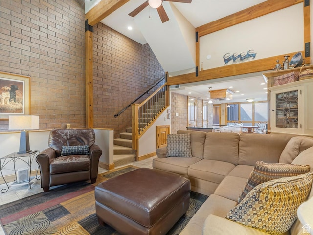 1679 Captain Molly Dr, Park City, UT 84060 - living room with a ceiling fan, high vaulted ceiling, brick wall, stairway, and beam ceiling