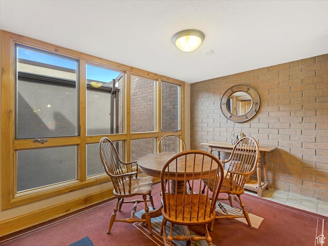1679 Captain Molly Dr, Park City, UT 84060 - carpeted dining area with brick wall