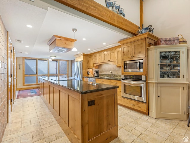 1679 Captain Molly Dr, Park City, UT 84060 - kitchen featuring stainless steel appliances, a center island, recessed lighting, decorative backsplash, and stone tile flooring