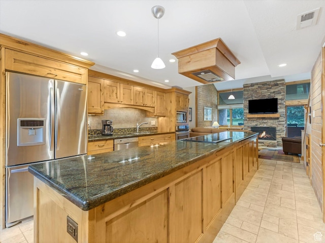 1679 Captain Molly Dr, Park City, UT 84060 - kitchen with stainless steel appliances, a stone fireplace, a large island, tasteful backsplash, and open floor plan