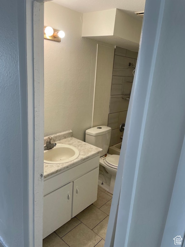768 N Redwood Rd W Unit 01, Salt Lake City, UT 84116 - full bathroom with vanity, tile patterned flooring, a textured wall, and washtub / shower combination